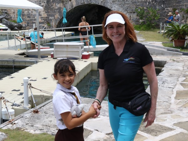 Girl shakes hand of Staff after winning Art Contest