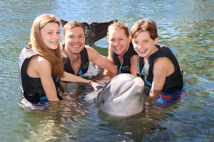 a group of people swimming in a body of water
