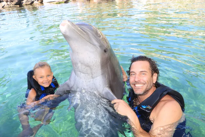 a man and woman swimming in the water